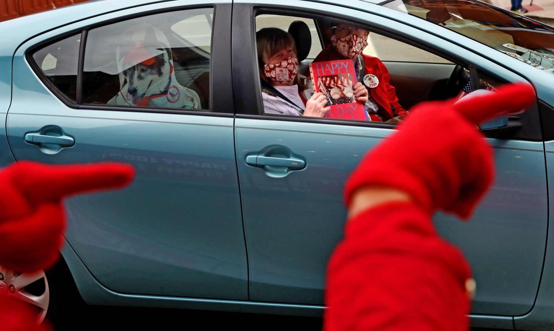 Drive-by parade celebrating 100th anniversary of The Man’s birth